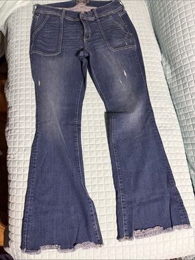 torrid Indigo Flare Jeans with Frayed Raw Hem